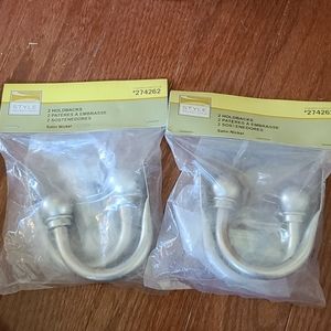 Brushed nickel curtin hold backs